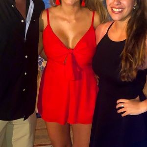 Women’s red Romper with pockets. Size: L